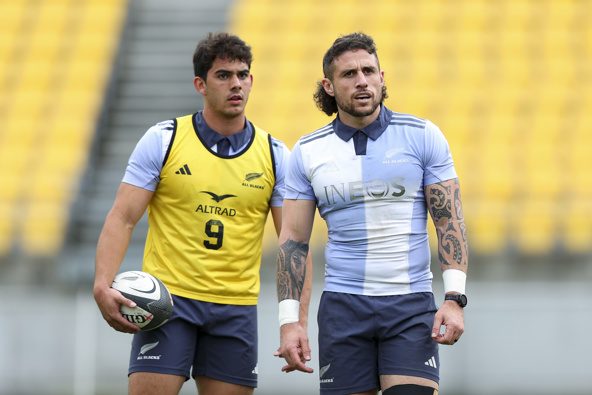 TJ Perenara (R) and Noah Hotham look on during a New Zealand All Blacks training session at Sky Stadium on August 08, 2024 in Wellington, New Zealand. (Photo by Hagen Hopkins/Getty Images)