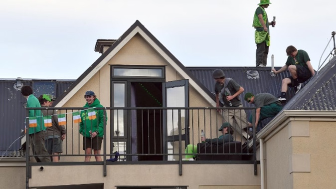 Students on a flat roof in Leith St. Photo / ODT