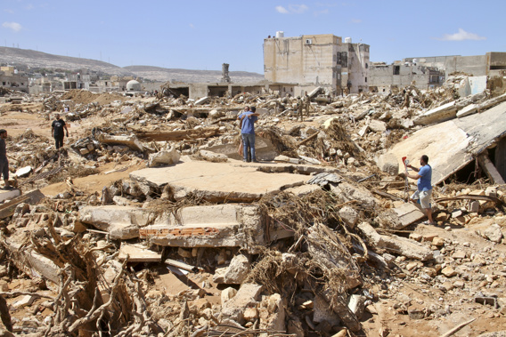 People look for survivors in Derna, Libya, Wednesday, Sept.13, 2023. Search teams are combing streets, wrecked buildings, and even the sea to look for bodies in Derna, where the collapse of two dams unleashed a massive flash flood that killed thousands of people. Photo / AP