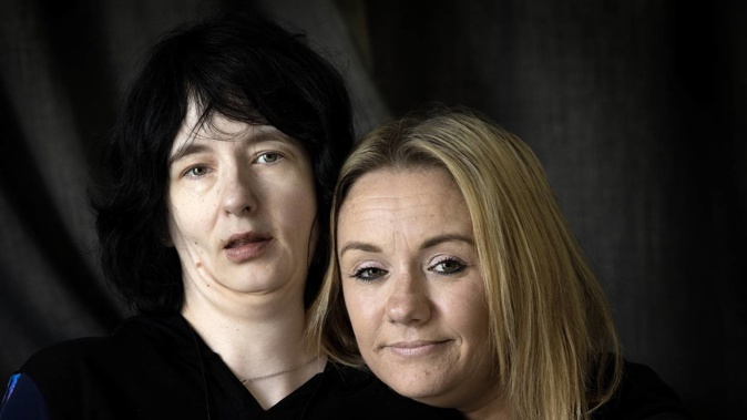 Anna Mills, 38 (left) who suffers from myotonic dystrophy, was in an IDEA Services residential care home before her sister Sarah-Jane Mills pulled her out after finding Anna in a neglected state. Photo / Mike Scott