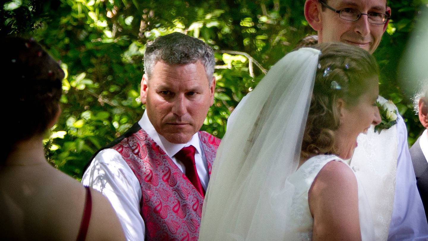 Groomsman Paul Wilson, left, with newly married couple David Bain, right, and Liz Davies, centre, after their wedding ceremony in Christchurch. Photo / Supplied