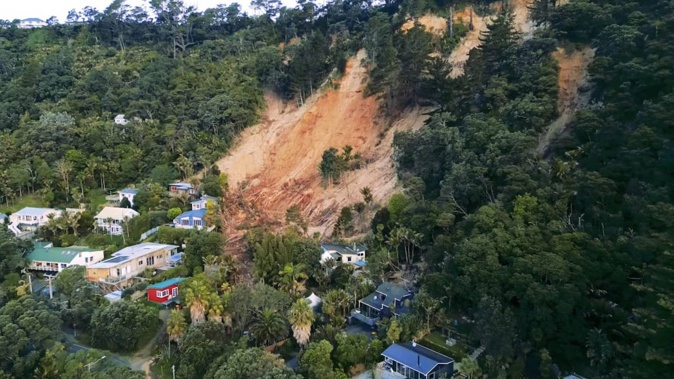 One of the land slips which prompted evacuations and red or yellow stickered homes at Muriwai on Auckland's west coast earlier this year. Photo / RNZ