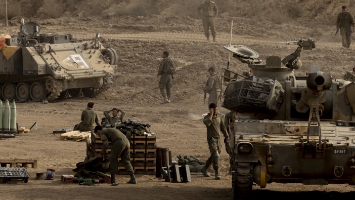 Israeli soldiers rest near artillery units near the border with the Gaza Strip on October 9, 2025 in Southern Israel, Israel. (Photo by Amir Levy/Getty Images)