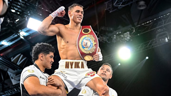 David Nyika is lifted on to his team members' shoulders as he celebrates his victory over Tommy Karpency. Photo / Photosport