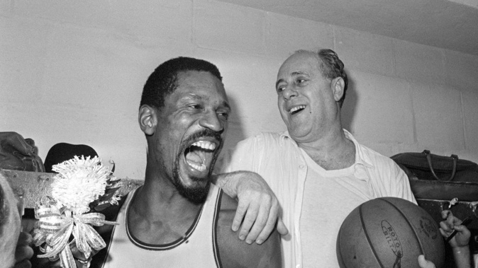 Boston Celtics' Bill Russell celebrates with coach Red Auerbach after defeating the LA Lakers, 95-93, to win their 8th-straight NBA championship, 1966. Photo / AP