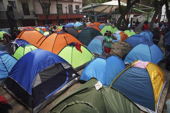 Haitian migrants camp out at the Giordano Bruno plaza in Mexico City. Photo / AP