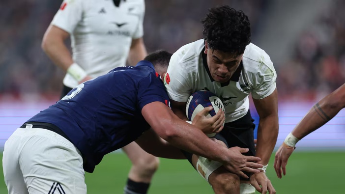 All Black no.8 Wallace Sititi is is tackled by French lock Emmanuel Meafou during the test match at Stade de France. Photo / AFP