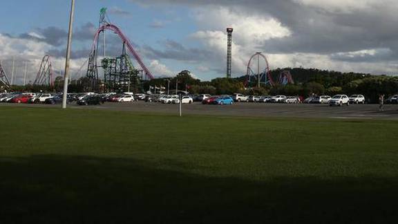 A young boy has been rushed to hospital with a serious head injury after falling from a ride at Movie World. Photo / news.com.au