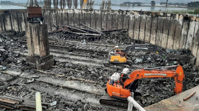 Contractors removing the material from the fire-damaged trickling filters at the wastewater treatment plant. (Photo / Christchurch City Council)