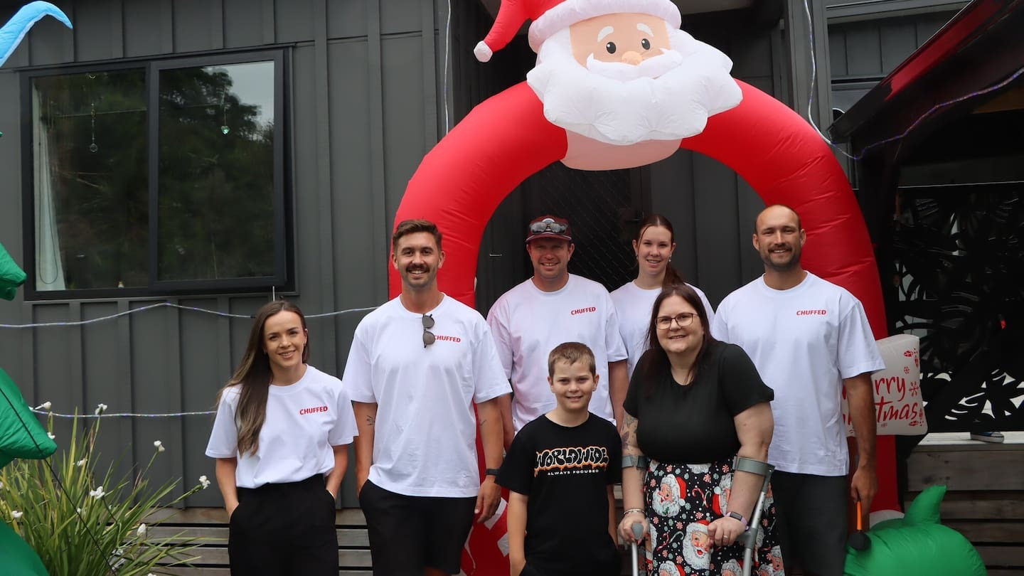 Chuffed Gifts team Jess (left), Alex, James, Holly and Todd with Maverick (9) and Andrea Atkinson (front centre). Photo / Kaitlyn Morrell