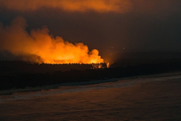 Matakana on fire. Photo / Alex Cairns