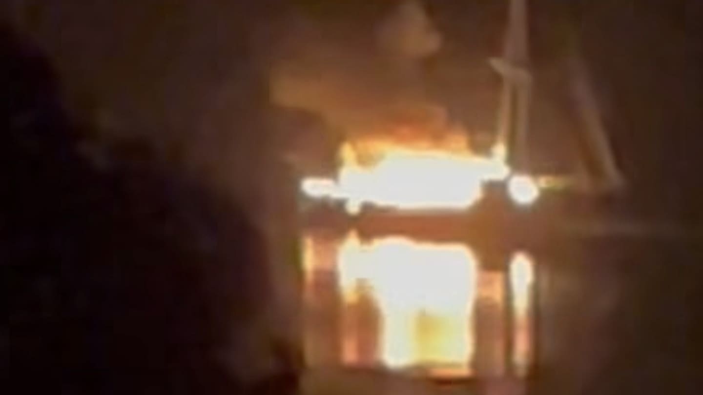 Loud bangs as burning boat lights up Waitematā Harbour