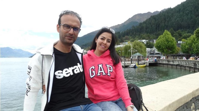 Aucklanders Amir Beli (left) and Jaberi Ebrahimi relax on Queenstown's waterfront yesterday. Photo / Guy Williams, Otago Daily Times