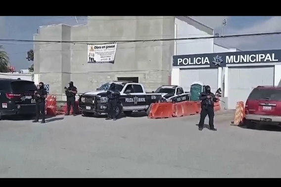 In this image made from video, Mexico’s police officers stand guard at the Ensenada station in Ensenada, Mexico, Thursday, May 2, 2024. Photo / AP 