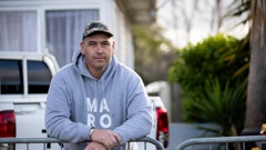 William Macneil outside his Beach Haven home, where a Kāinga Ora neighbour allegedly lunged at him with a butcher's knife then threatened to ram raid his house while he and his family were inside. Photo / Dean Purcell
