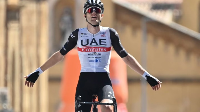 New Zealand's Finn Fisher-Black celebrates as he crosses the finish line to win the first stage of the Tour of Sicily cycling race from Marsala to Agrigento, Italy. Photo / AP