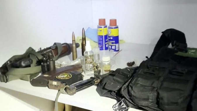 Footage released by the Israel Defence Forces shows a bulletproof vest with a Hamas insignia and weapons - the IDF says the items were found in a medical closet at Shifa Hospital. Photo / AP