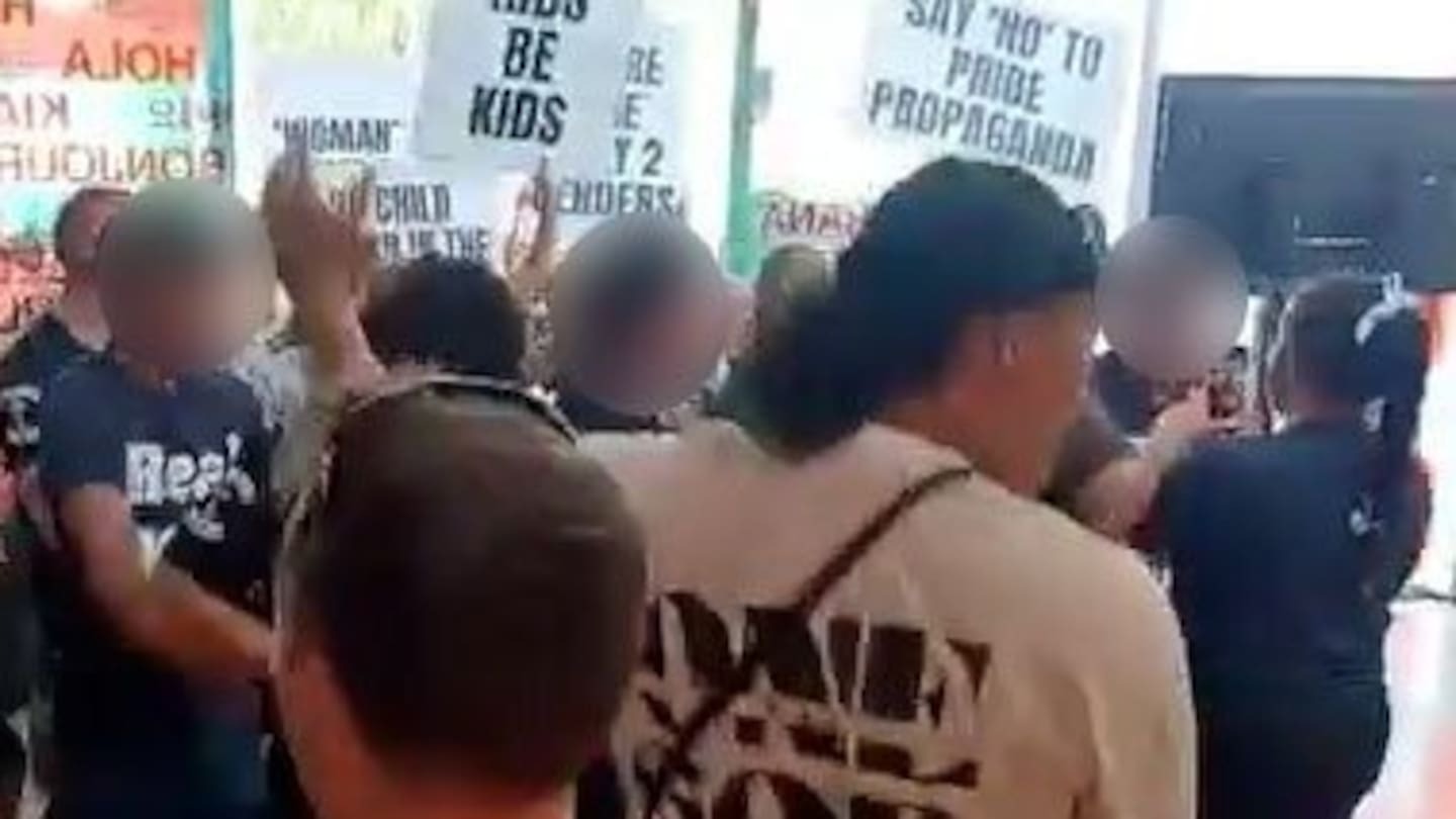 Destiny Church groups Man Up and Legacy Sisterhood protest against a children's library drag event at Te Atatū Community Centre.