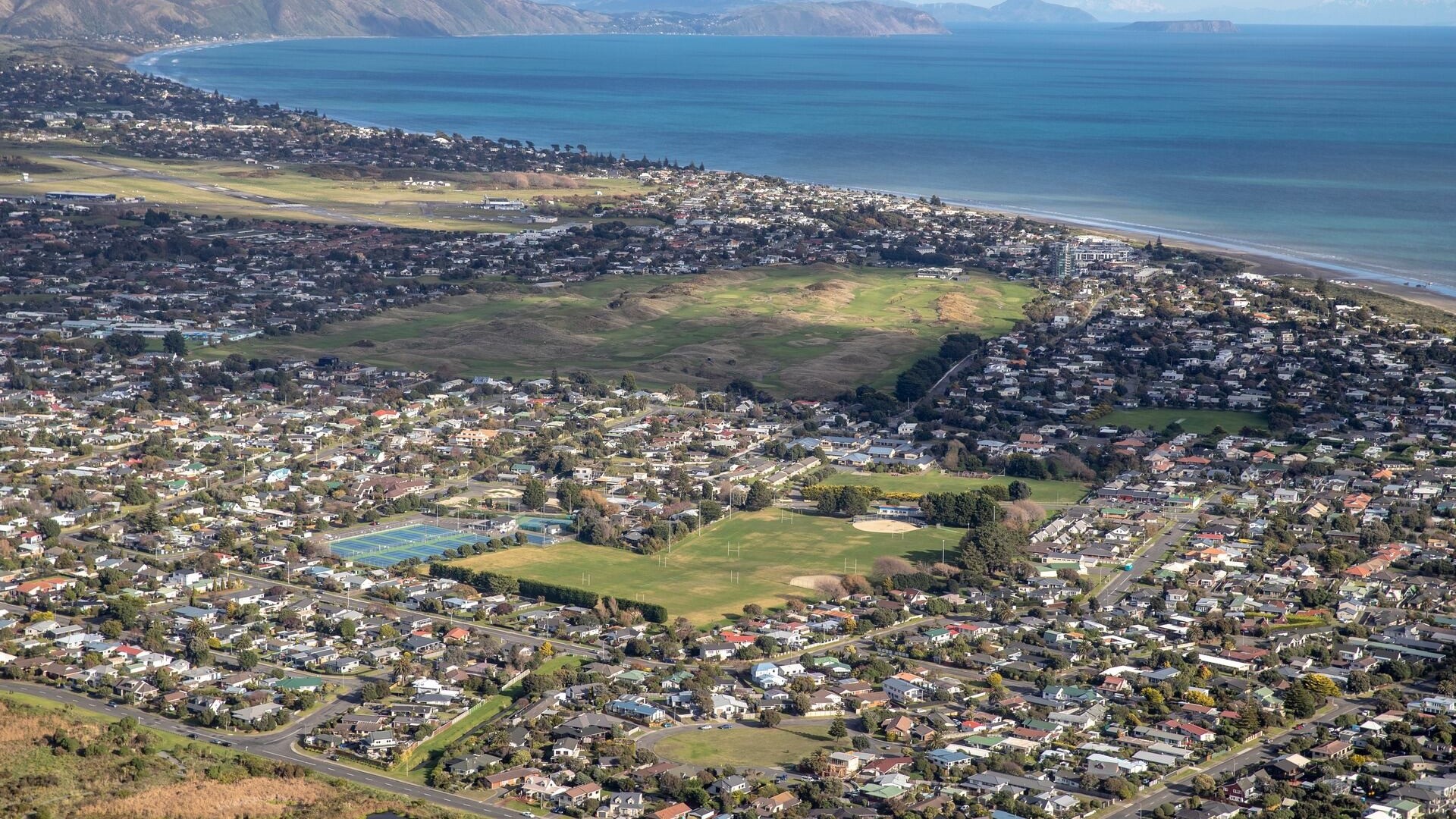 Man arrested after police find woman's body at Raumati Beach home