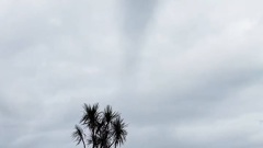 A waterspout hit Awatuna. Photo / still from video by Elizabeth Meaclem