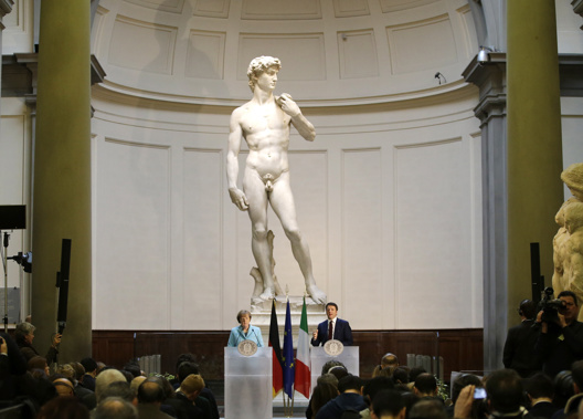 German Chancellor Angela Merkel, left, and Italian Prime Minister Matteo Renzi speak during a press conference in front of Michelangelo's David statue. Photo / AP
