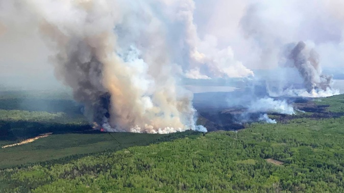 There are 90 active wildfires in Alberta, Canada, and more than 20,000 people have been evacuated from their homes because of shifting fire conditions. Photo / Government of Alberta Fire Service via AP