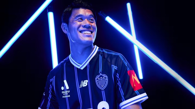 Auckland FC player Hiroki Sakai shows off the club's new home jersey.