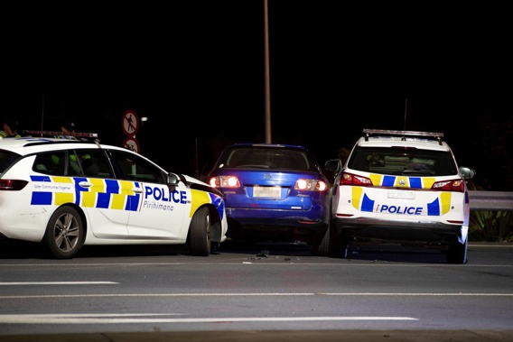 Police stop a blue car thought to be involved in a burglary in Silverdale overnight. (Photo / Hayden Woodward)