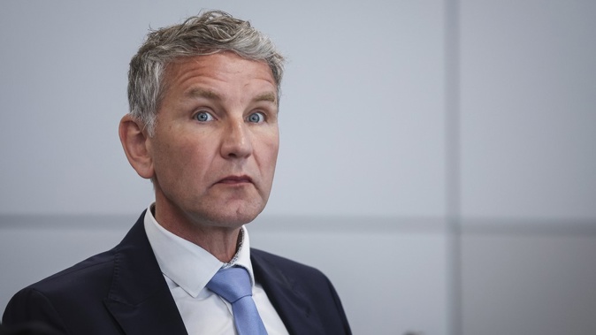 Bjoern Hoecke, co-leader of the far-right Alternative for Germany (AfD) party in the eastern federal state of Thuringia, waits for a session of his trial over the alleged use of Nazi phrases, at the regional court in Halle, Germany, Tuesday, May 14, 2024. (Ronny Hartmann/Pool Photo via AP)