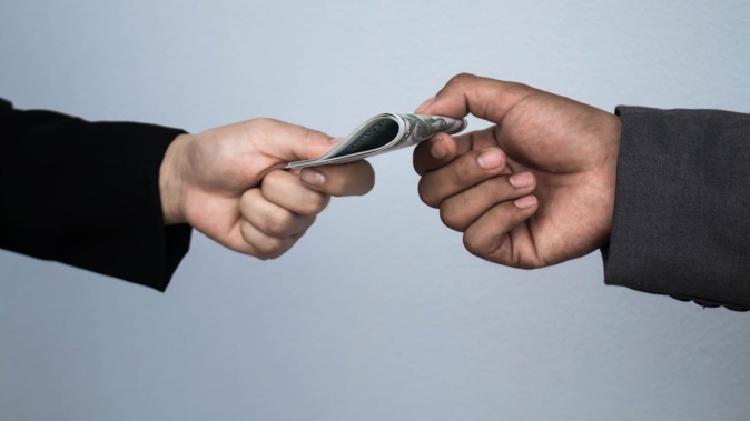 Hua Wu claimed he was blackmailed into paying his former employer $1.2 million after he'd stolen $400,000. Photo / 123RF