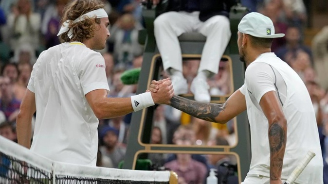 Australia's Nick Kyrgios shakes hands at the net with Greece's Stefanos Tsitsipas after winning their third round men's singles match at Wimbledon. Photo / AP
