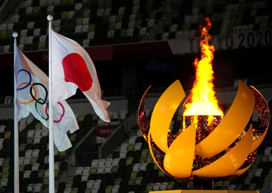 The Olympic flame is finally lit in Tokyo's National Stadium. (Photo / AP)