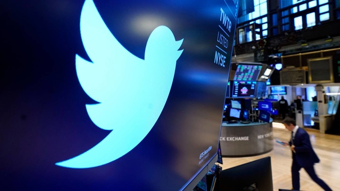 The logo for Twitter appears above a trading post on the floor of the New York Stock Exchange. Photo / AP