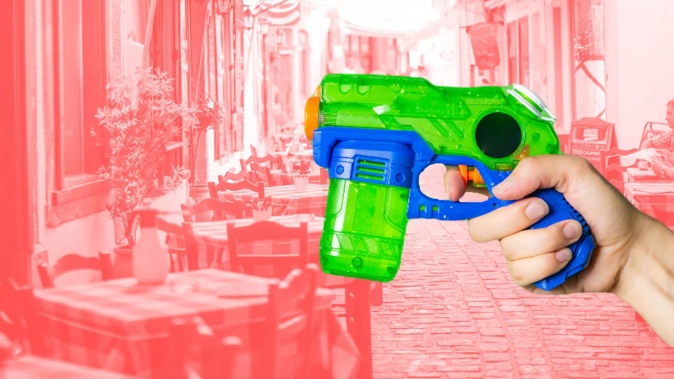 Protestors used water pistols on tourists visiting Barcelona. Photo / 123rf