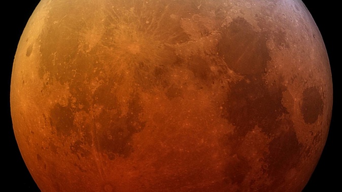 A "blood supermoon" is the rare combination of a total lunar eclipse and the moon being at its closest point in its orbit around Earth, making it appear much larger than usual. (Photo / Stardome)