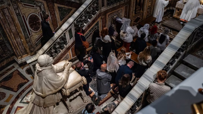 People pray after visiting the tomb of Pope Francis at Santa Maria Maggiore Basilica in Rome. Photo / Washington Post
