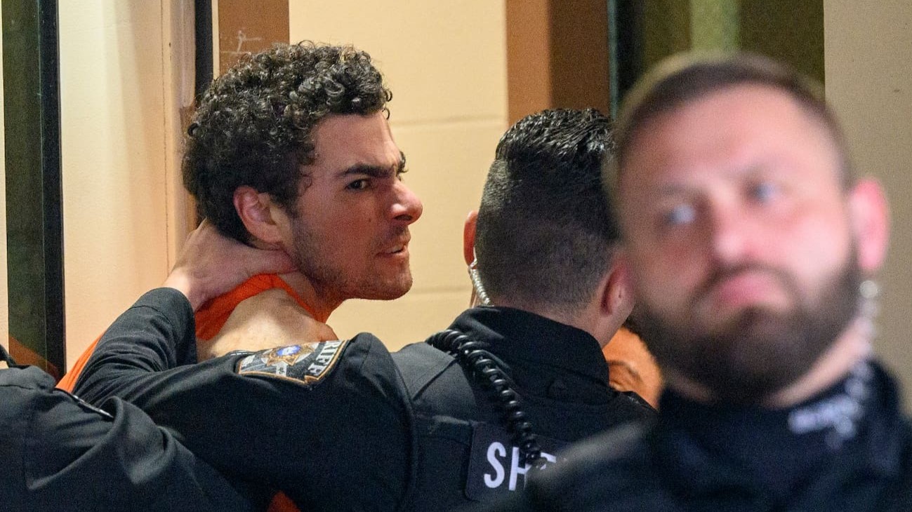 Suspected shooter Luigi Mangione is led into the Blair County Courthouse for an extradition hearing. Photo / Getty Images