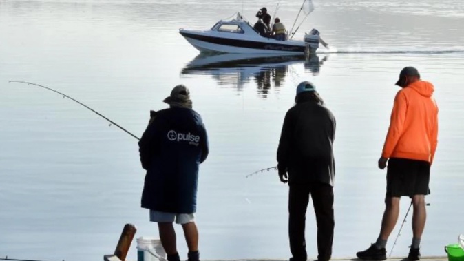 Fishing for salmon has been a popular pastime in Otago Harbour for decades. Photo / Otago Daily Times