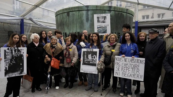 French nazi hunter Serge Klarsfeld (right), his wife Beata (second from right) and French Holocaust survivors Edith Senot (third from left) and Ginette Kolinka (fifth from left). Photo / AP