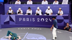 B-Girl Raygun of Team Australia competes as Syssy of Team France looks on during the B-Girls Round Robin. Photo / Getty Images