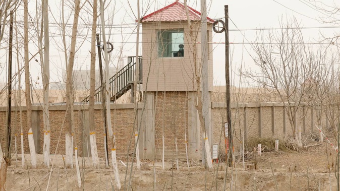 A security guard watches from a tower around a detention facility in Yarkent County in northwestern China's Xinjiang Uyghur Autonomous Region. Photo / AP