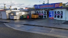 A white van carrying a 2-month-old baby was stolen from outside Blue2 Laundromat in Te Atatu South, Auckland today. Photo / Google Maps