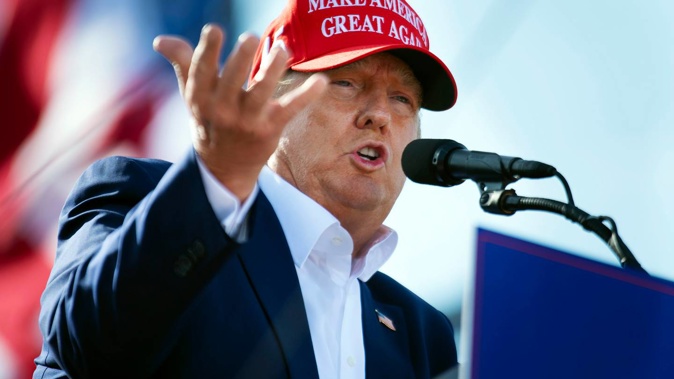 Former President Donald Trump speaks from the podium during a campaign rally on May 1. Photo / AP