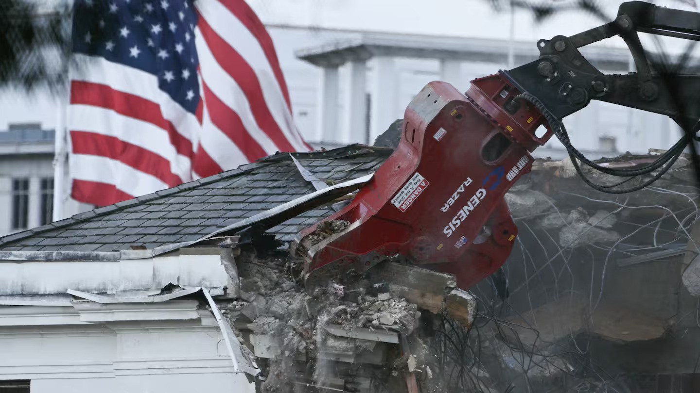Heavy machinery tears down a section of the East Wing of the White House as construction begins on US President Donald Trump's planned ballroom, in Washington, DC. Photo / Brendan Smialoski, AFP