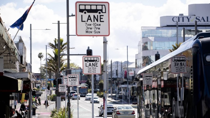 New signs erected on K Rd, signalling longer bus lane hours. Photo / Dean Purcell