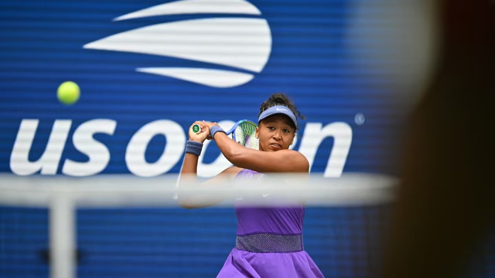 Japan's Naomi Osaka plays a backhand return to USA's Coco Gauff during their women's singles round of 16 at the US Open. Photo / AFP
