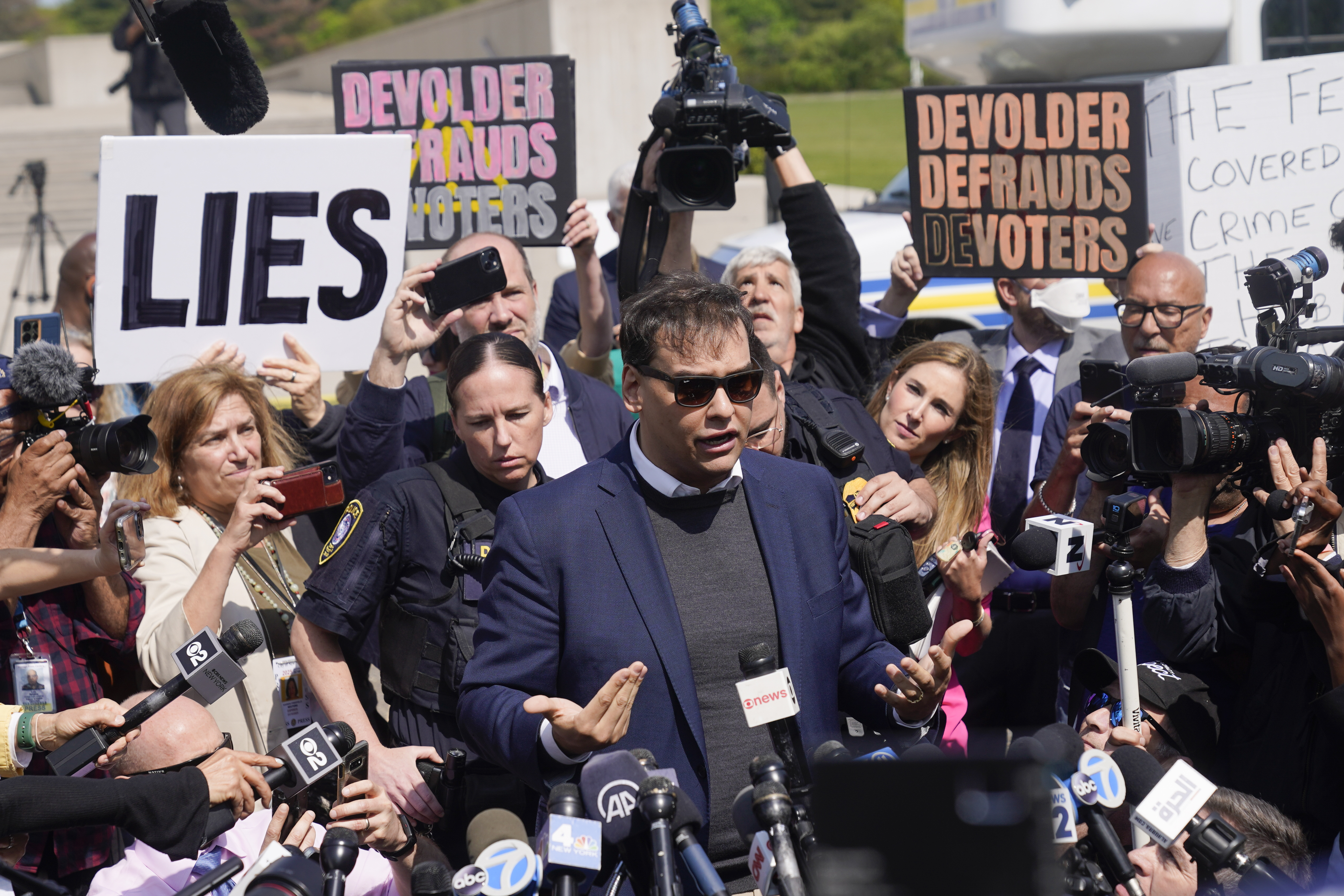 U.S. Rep. George Santos leaves the federal courthouse in Central Islip, N.Y. Photo / AP