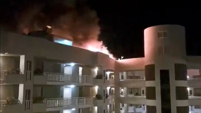 An eyewitness has described how a helicopter flew around before crashing into a far north Queensland hotel roof in a "massive explosion", killing the pilot. Photo / Ghulam Abbas Shah