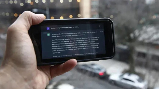 A ChatGPT prompt is shown on a device near a public school in Brooklyn, New York. Photo / AP
