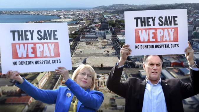 Deputy Mayor Sophie Barker and Mayor Jules Radich protest cutbacks to the new Dunedin hospital design in the Octagon on Thursday. Photo / ODT
